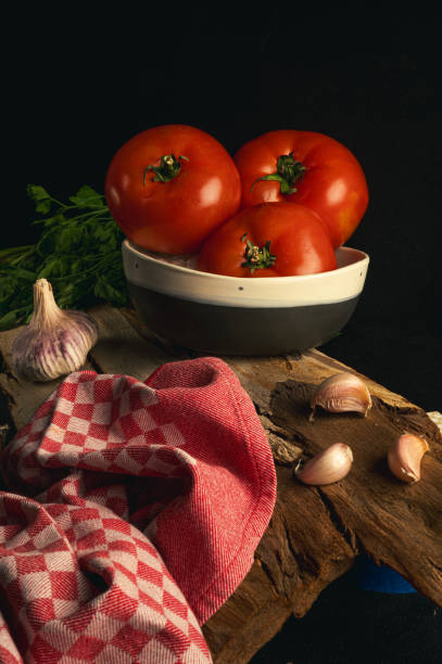 istock Rustic Still Life with Tomatoes, Garlic, and Parsley 2198797562
