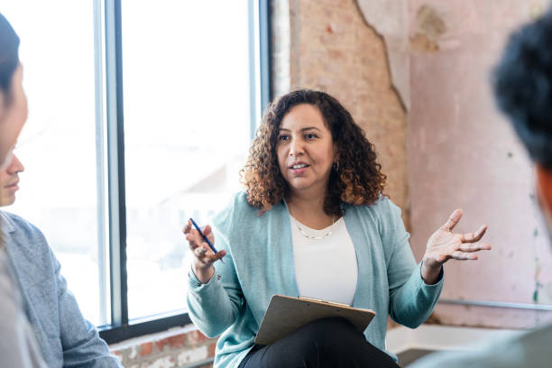 istock Group Therapy Session: Latina Therapist Leading Discussion 2198798467