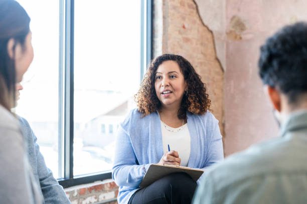 istock Group therapy session with a mental health professional 2198798476