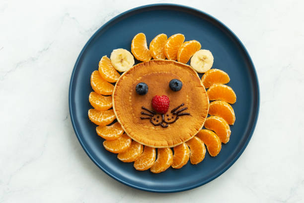istock Funny kids breakfast, lion face pancakes 2198798978