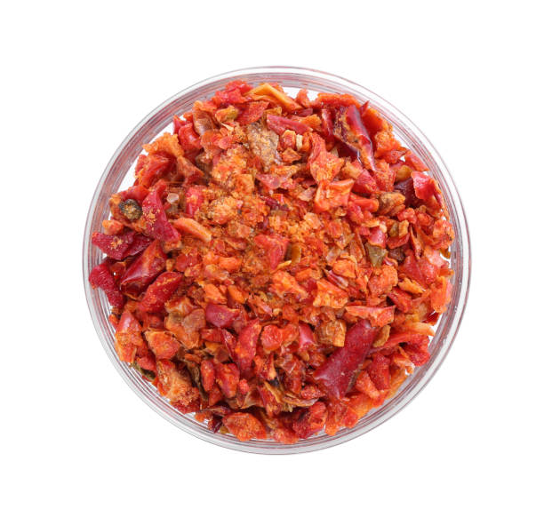 istock Aromatic spice. Red chili pepper flakes in bowl isolated on white, top view 2198802984
