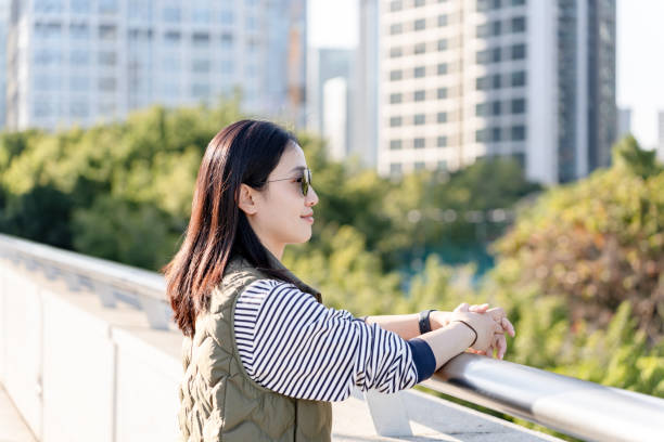 istock Beautiful young female financial executive, standing on the platform 2198804407