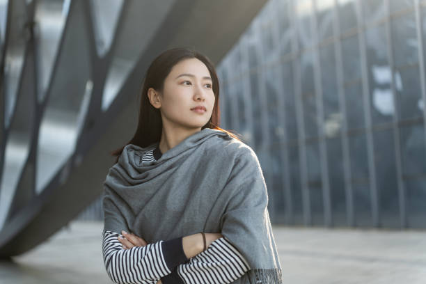 istock Beautiful young female financial executive, standing on the platform 2198804461