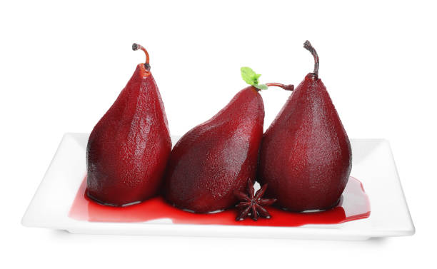 istock Tasty red wine poached pears with mint and anise isolated on white 2198805473
