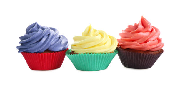 istock Different tasty cupcakes with cream isolated on white 2198805485