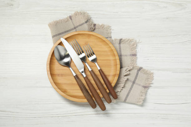 istock Stylish setting with elegant cutlery on white wooden table, top view 2198806516
