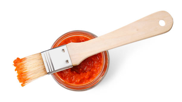 istock Fresh marinade in jar and basting brush isolated on white, top view 2198806570