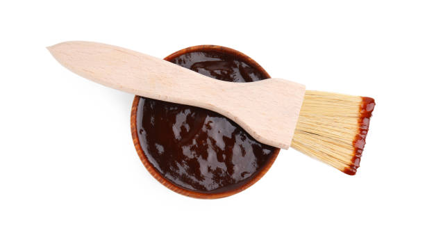istock Fresh marinade in bowl and basting brush isolated on white, top view 2198806572