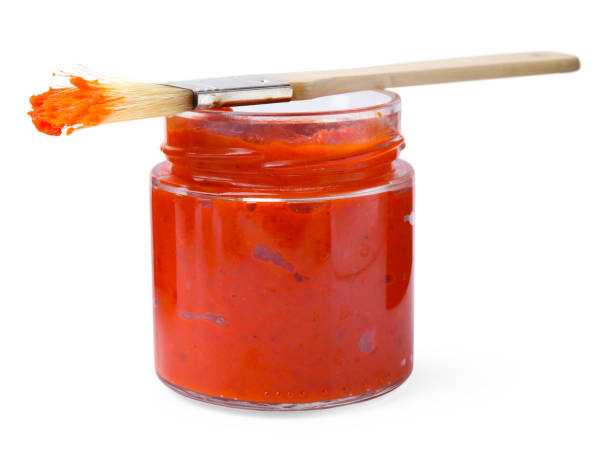istock Fresh marinade in jar and basting brush isolated on white 2198806599