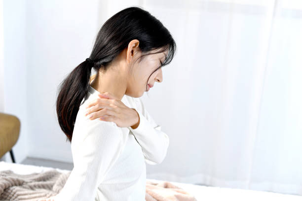 istock Asian young woman suffering from stiff shoulders 2198807613