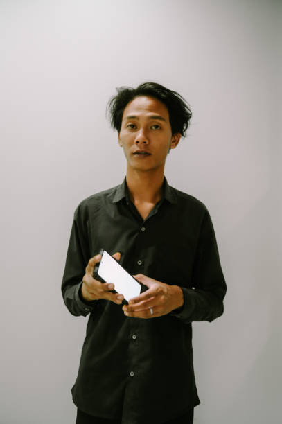 istock Man Showing a blank smartphone screen F 2198812641