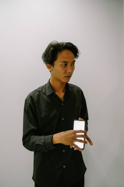 istock Man Showing a blank smartphone screen C 2198813299