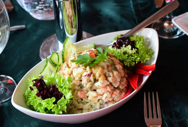 istock Salad Olivier with fresh vegetables 2198819973