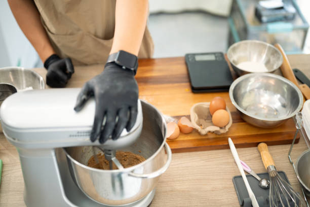 istock Baker mixing cookie dough with a stand mixer. Small business concept 2198823672