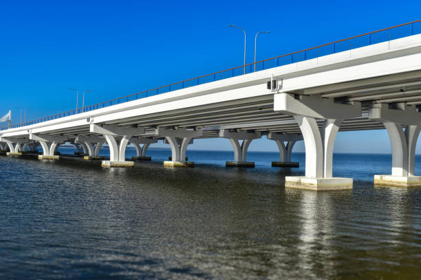 istock Three Mile bridge: Modern architecture in white over calm blue Florida waters. 2198823856