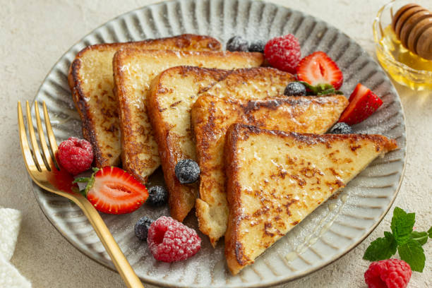 istock french toasts with honey and fresh berries 2198826403
