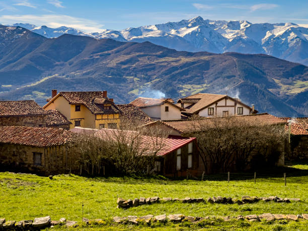 istock Charming village with snow-capped mountain backdrop 2198827077