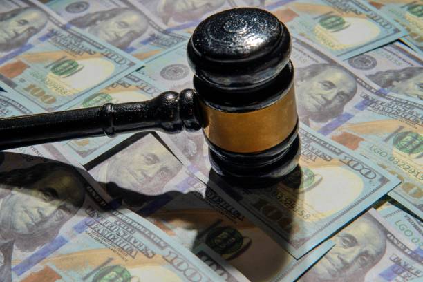 istock Closeup image of gavel and money. 2198827710