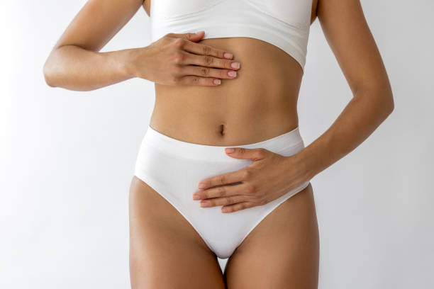 istock Female model massaging her abdomen 2198828199
