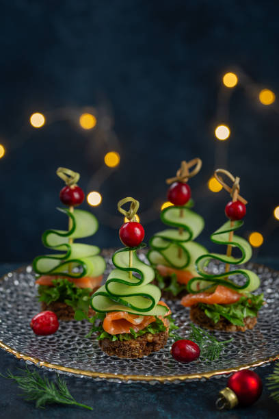 istock Smoked salmon and  cucumber Christmas trees canapes 2198829846