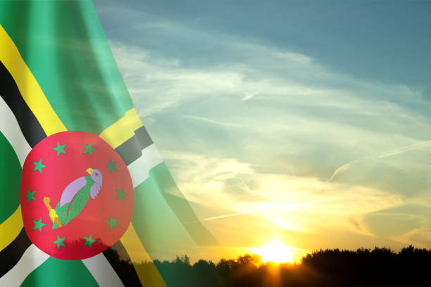 Flag of Dominica against the sunset. National Holidays concept