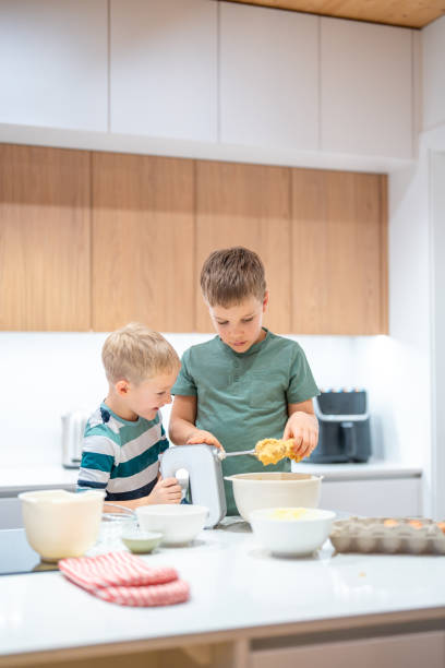 istock Young Caucasian Brothers Baking Together at Home 2198834773
