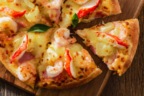 istock pizza on wooden background 2198840851