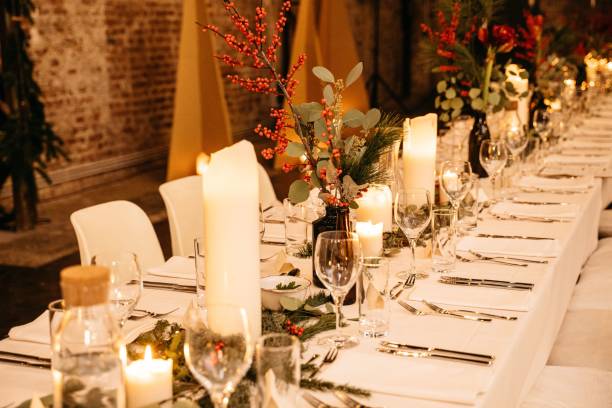 istock Elegant festive table setting with candles and flowers. 2198841406