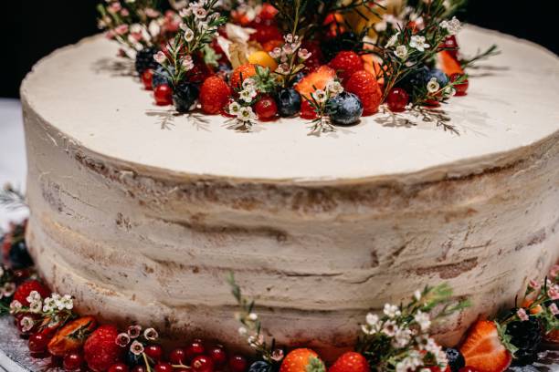 istock Rustic cake with fresh berries and flowers. 2198841481