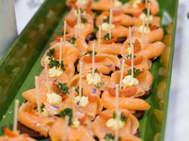 istock Smoked salmon canapes with cream and herbs 2198841648