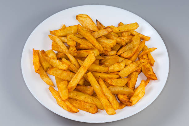 istock French fries on white dish on a gray background 2198843666