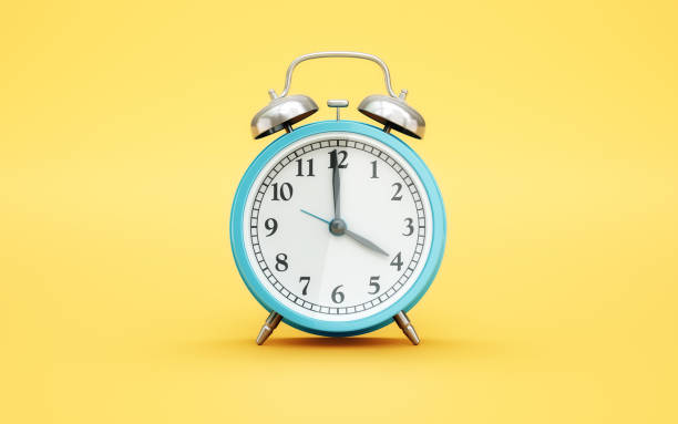istock Blue Alarm Clock Reaching 4 on Light Pink Soft Background 2198844017