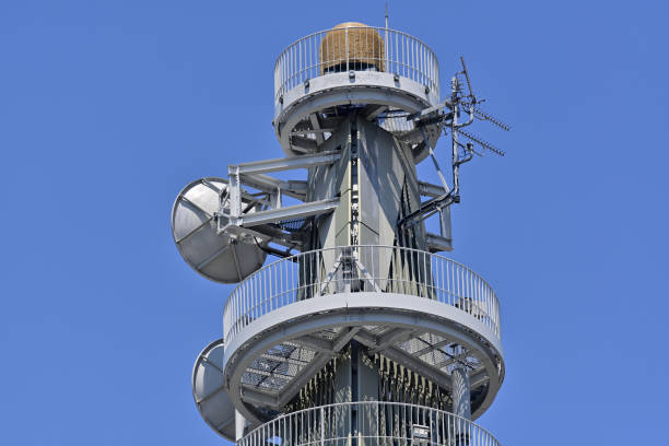 Radio communication tower towering against the blue sky