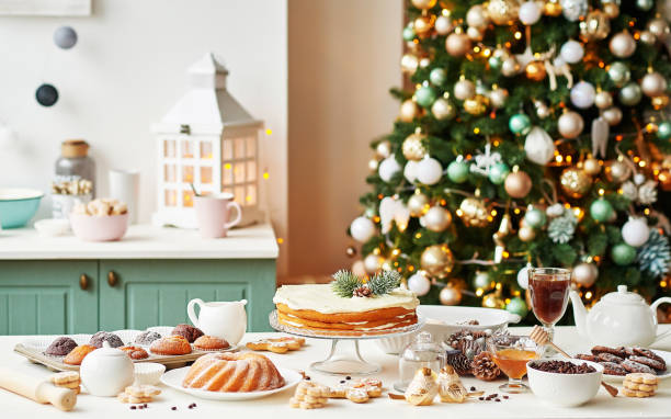 istock Christmas cake and sweets on table. Christmas decorations with lights background. Happy New Year! Christmas greeting card. Winter card template. Xmas concept. Holiday Banner. Feast of Nativity. 2198844842
