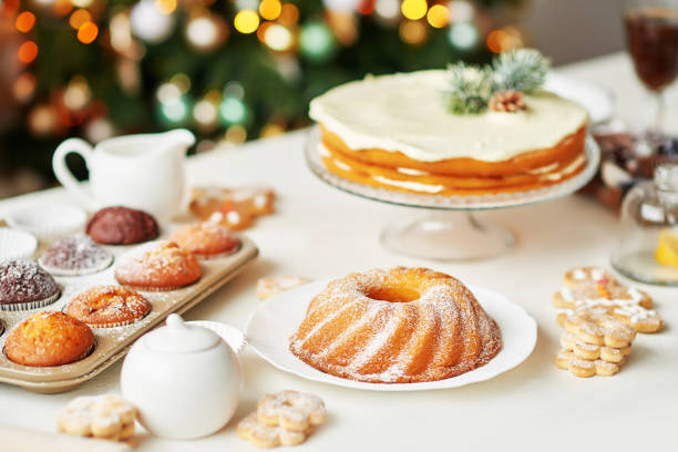 istock Christmas cake and sweets on table. Christmas decorations with lights background. Happy New Year! Christmas greeting card. Winter card template. Xmas concept. Holiday Banner. Feast of Nativity. 2198844968