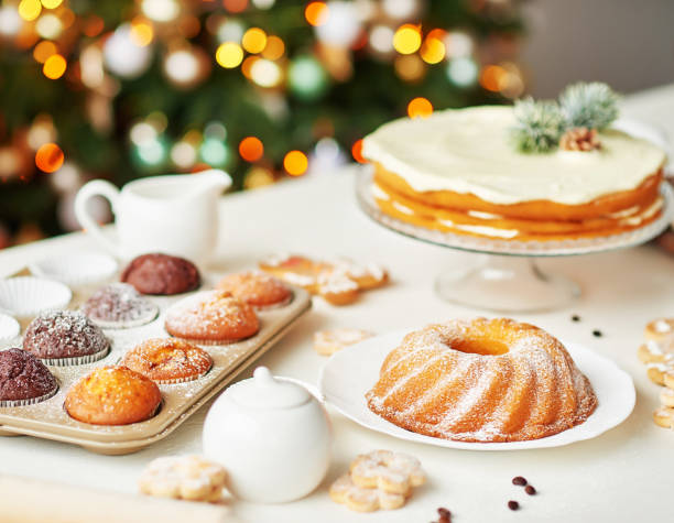 istock Christmas cake and sweets on table. Christmas decorations with lights background. Happy New Year! Christmas greeting card. Winter card template. Xmas concept. Holiday Banner. Feast of Nativity. 2198845132
