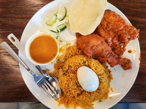 A close-up photo of a Chicken Biryani meal.