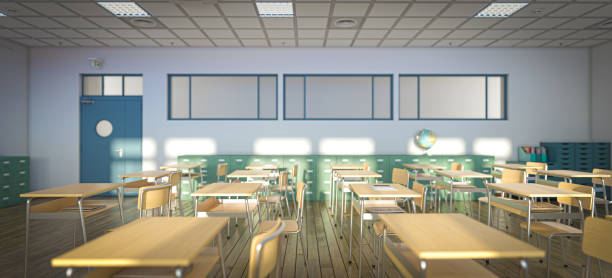 istock Sunlight is streaming into an empty classroom, illuminating rows of desks and chairs, ready for the start of the school day 2198846435