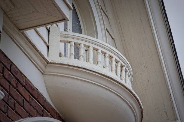 istock Balcony under an upper story window in a brick building 2198847114