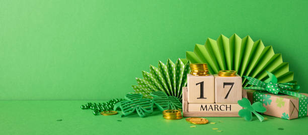istock Festive St. Patrick's Day arrangement with green elements, shamrock decor, and a calendar date symbolizing March 17 for celebration 2198847676