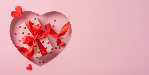 istock Heart shaped gift box with ribbon on pink background for Valentine's Day 2198847705