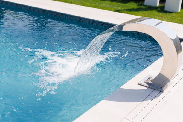istock Modern Swimming Pool with Stainless Steel Waterfall 2198849247