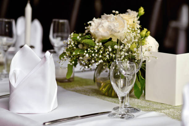 istock Bouquets with drinking glasses and napkin at Wedding table 2198852284