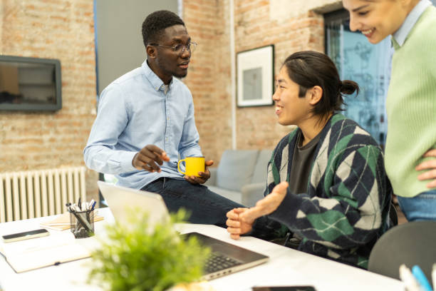 istock Young multiracial colleagues working on laptop at office 2198852435