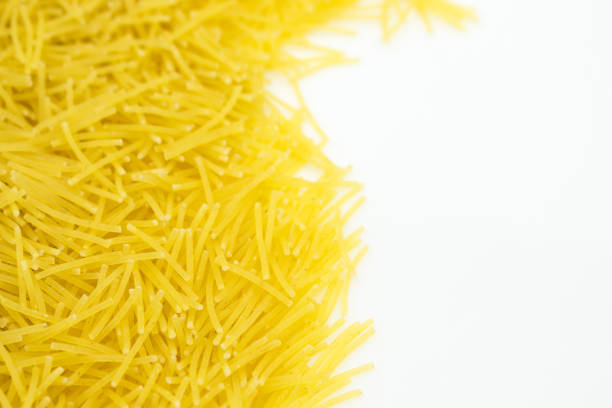 Natural organic healthy pasta, food macro texture background, representing a healthy lifestyle, wellbeing and body care, top view with a large copy space area
