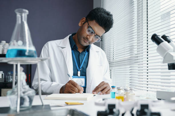 istock Working in Modern Laboratory Wearing Glasses 2198854061