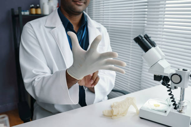 istock Donning Gloves in Laboratory While Preparing Equipment 2198854531
