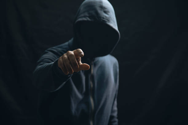 istock the hacker in the hood clicks on the viral screen 2198855838