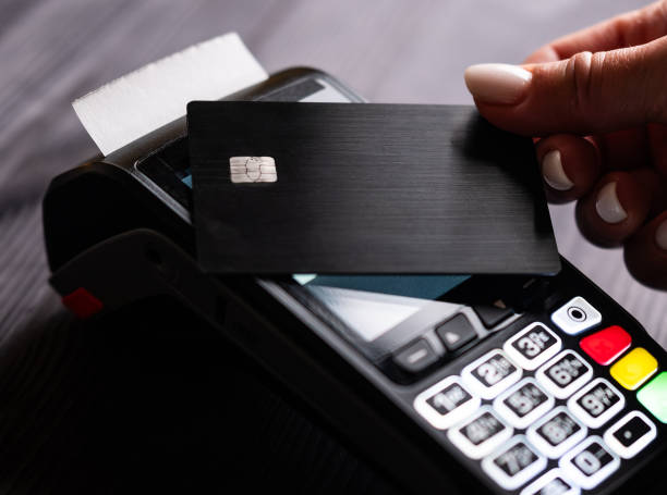 istock Girl Paying By Credit Card With Wireless Pos Terminal 2198858571