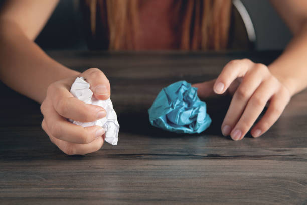 istock woman holding crumpled paper. concept idea 2198858654